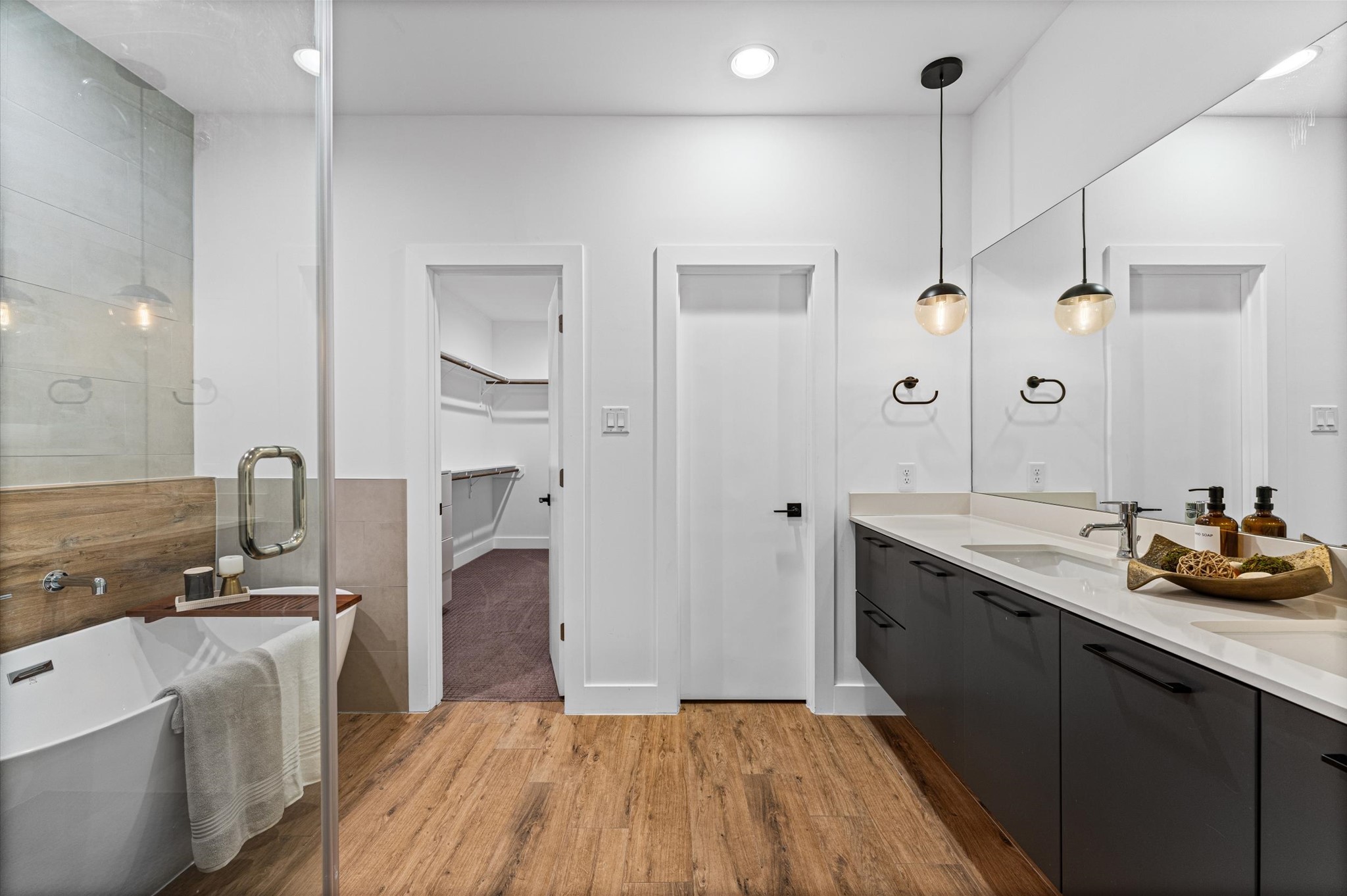 1404 Bailey Street Houston, TX 77019 - Photo 19 of 25 a spacious bathroom with a double vanity sink a mirror and a shower