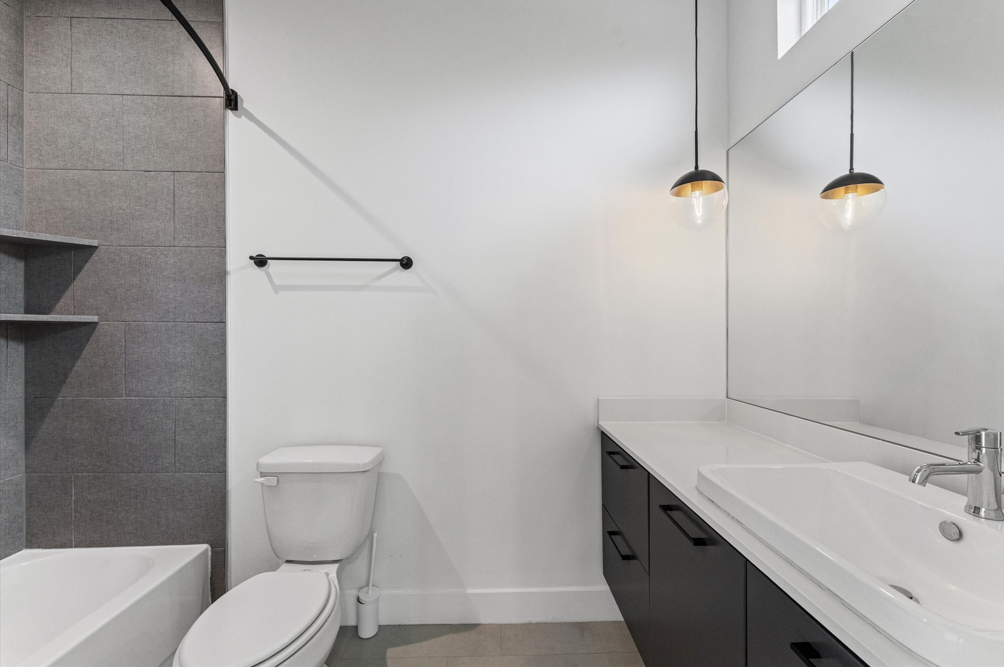 1404 Bailey Street Houston, TX 77019 - Photo 22 of 25 a bathroom with a sink a toilet and shower