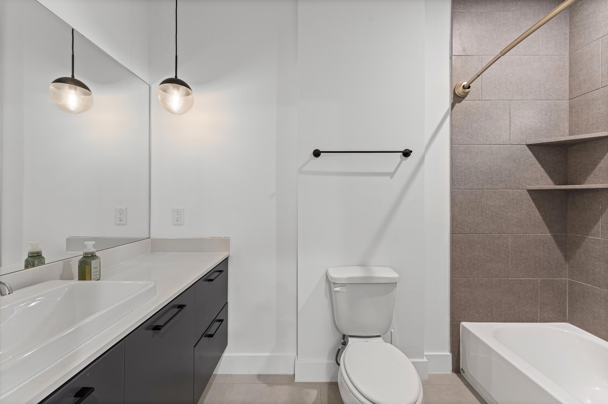 1404 Bailey Street Houston, TX 77019 - Photo 6 of 25 a bathroom with a sink a toilet a mirror and shower