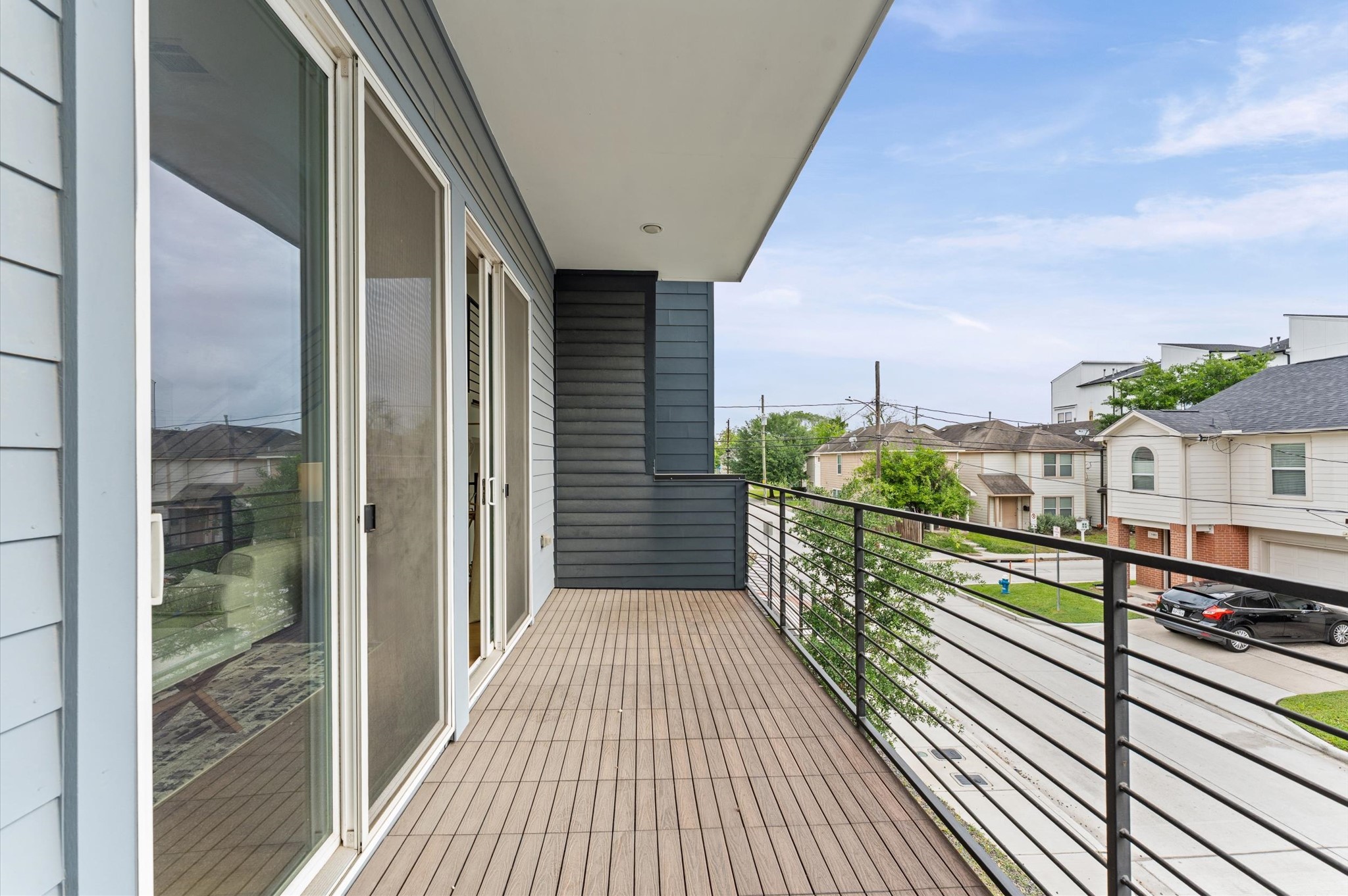 1404 Bailey Street Houston, TX 77019 - Photo 9 of 25 a view of balcony with wooden floor and city view
