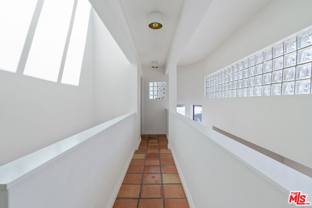 29221 Heathercliff Road, Unit 2 Malibu, CA 90265 - Photo 13 of 19 a view of a hallway with a white walls