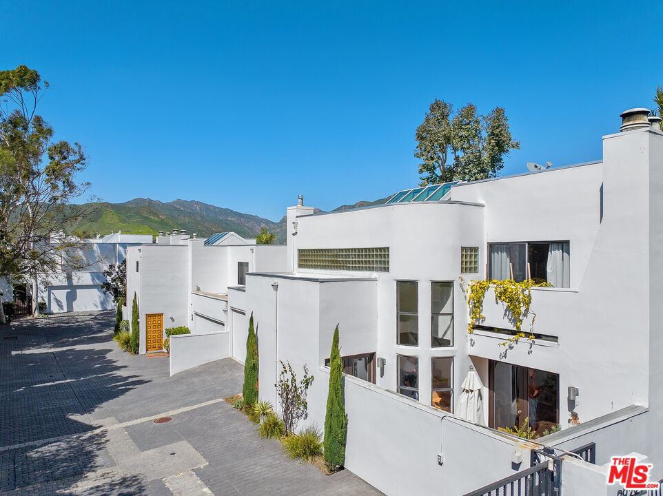 29221 Heathercliff Road, Unit 2 Malibu, CA 90265 - Photo 2 of 19 a front view of a building with outdoor seating