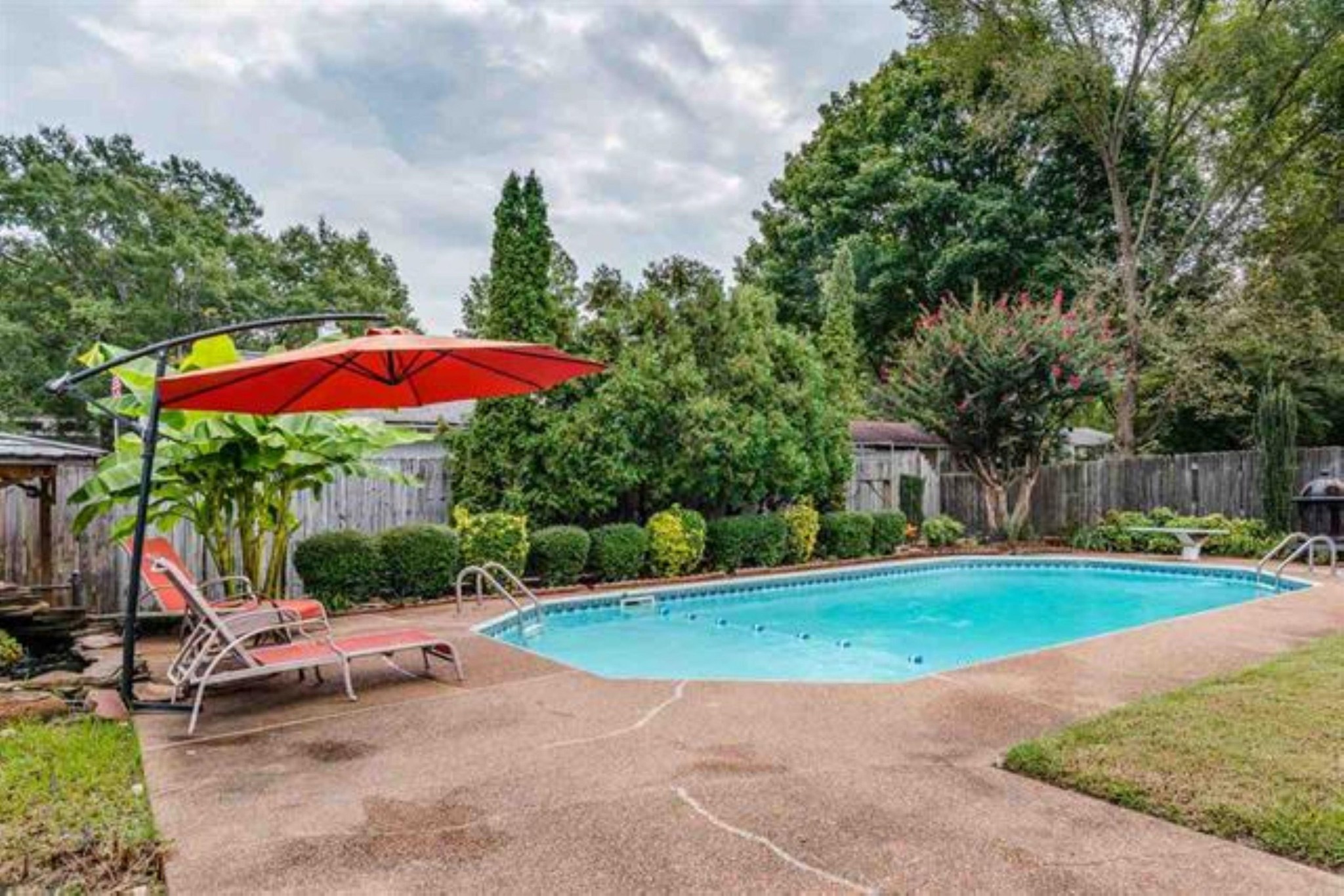 a view of a backyard with a patio
