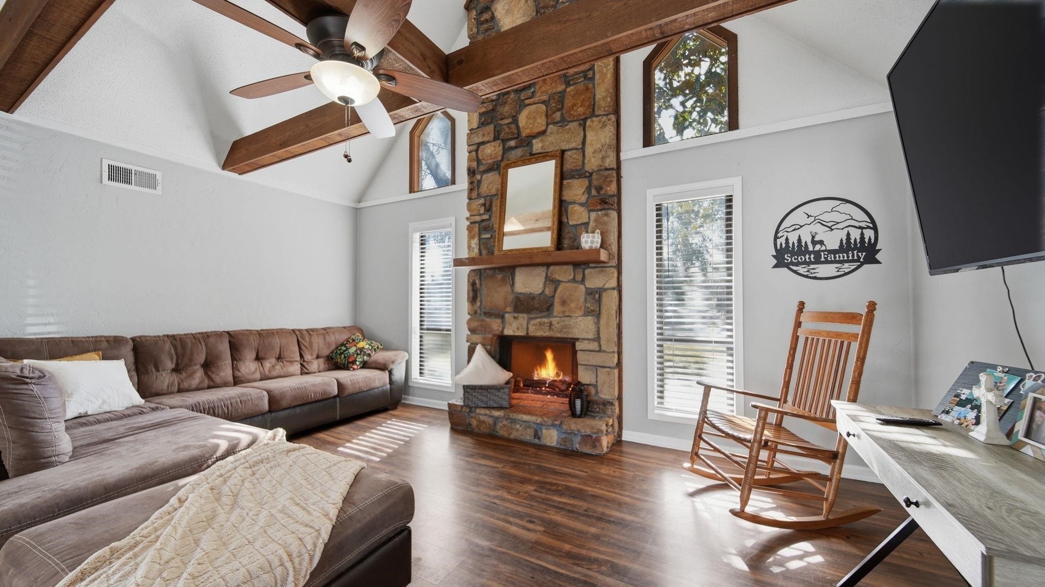 4182 Luther Road Memphis, TN 38135 - Photo 12 of 40 a living room with furniture a fireplace furniture and a large window