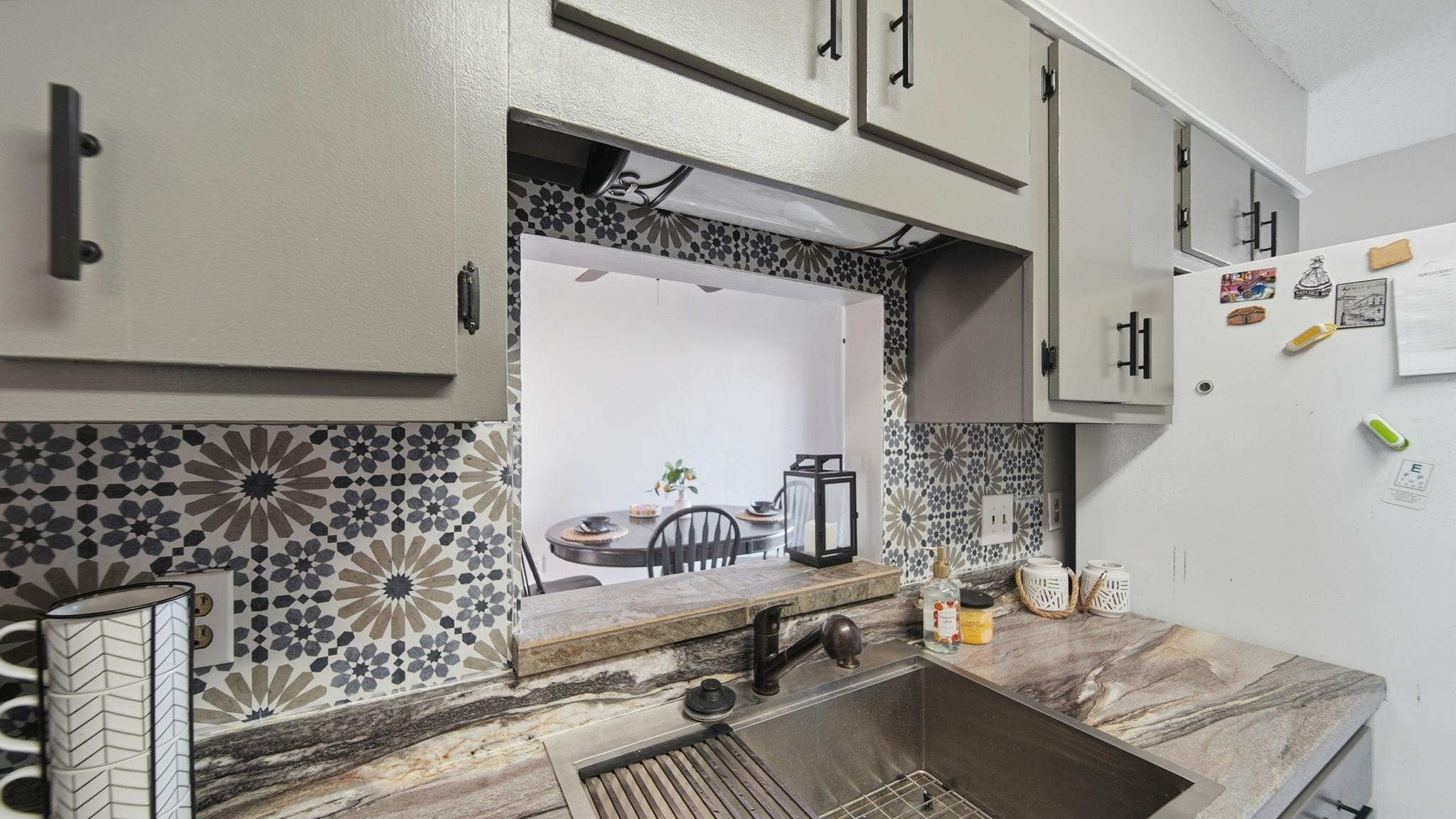 4182 Luther Road Memphis, TN 38135 - Photo 19 of 40 a kitchen with granite countertop a sink and a stove top oven