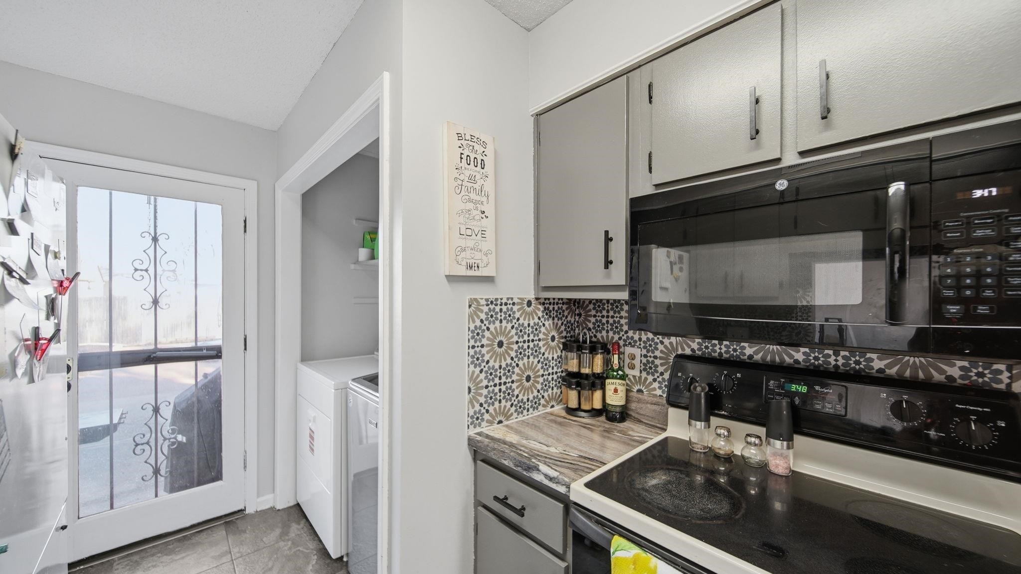 4182 Luther Road Memphis, TN 38135 - Photo 20 of 40 a kitchen with granite countertop a sink stove and cabinets