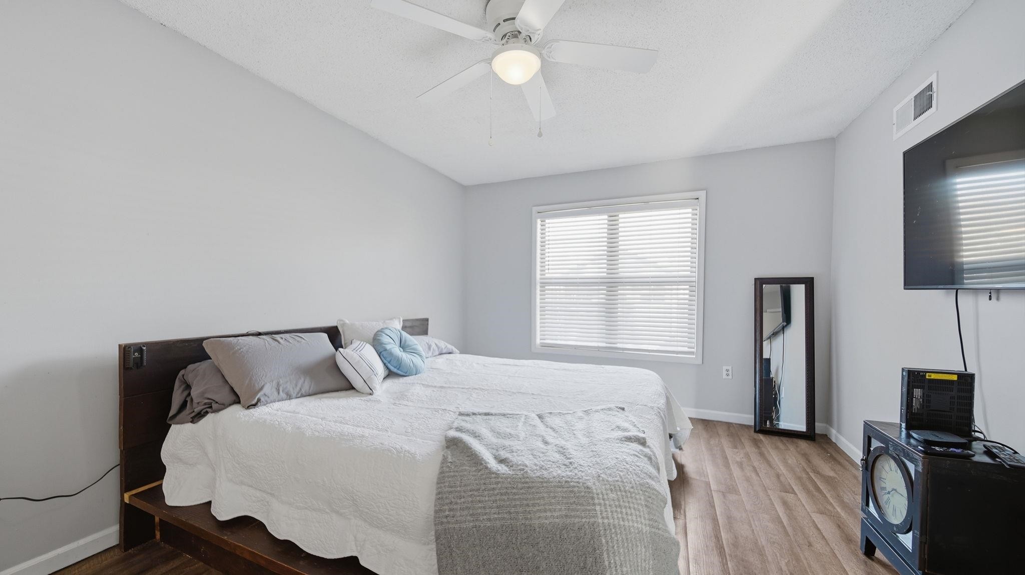 4182 Luther Road Memphis, TN 38135 - Photo 23 of 40 a bedroom with a bed tv and a window
