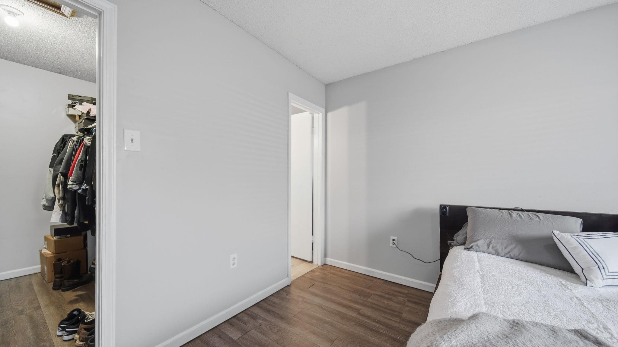 4182 Luther Road Memphis, TN 38135 - Photo 25 of 40 a bedroom with a bed and wooden floor