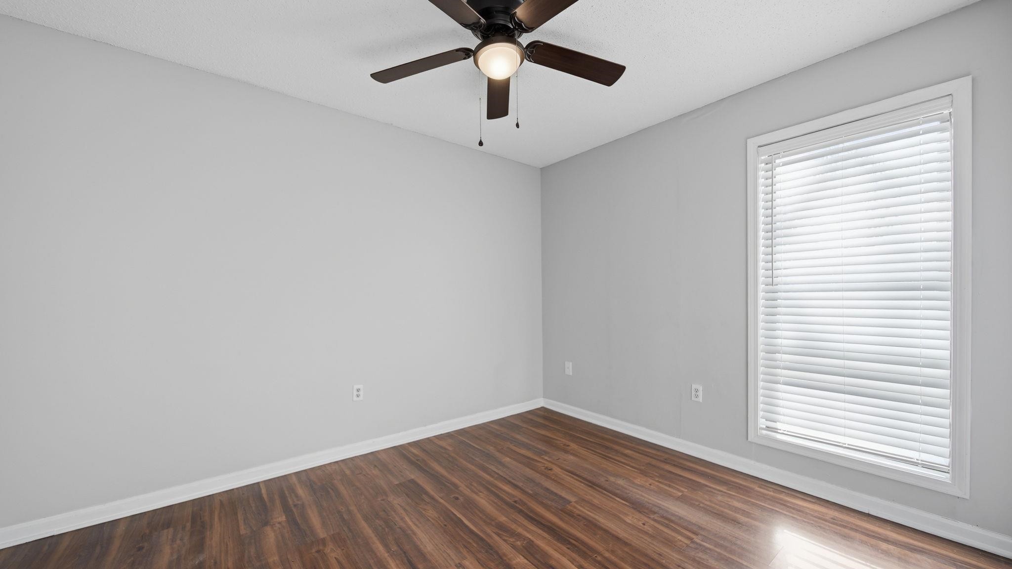 4182 Luther Road Memphis, TN 38135 - Photo 29 of 40 wooden floor in an empty room with a window