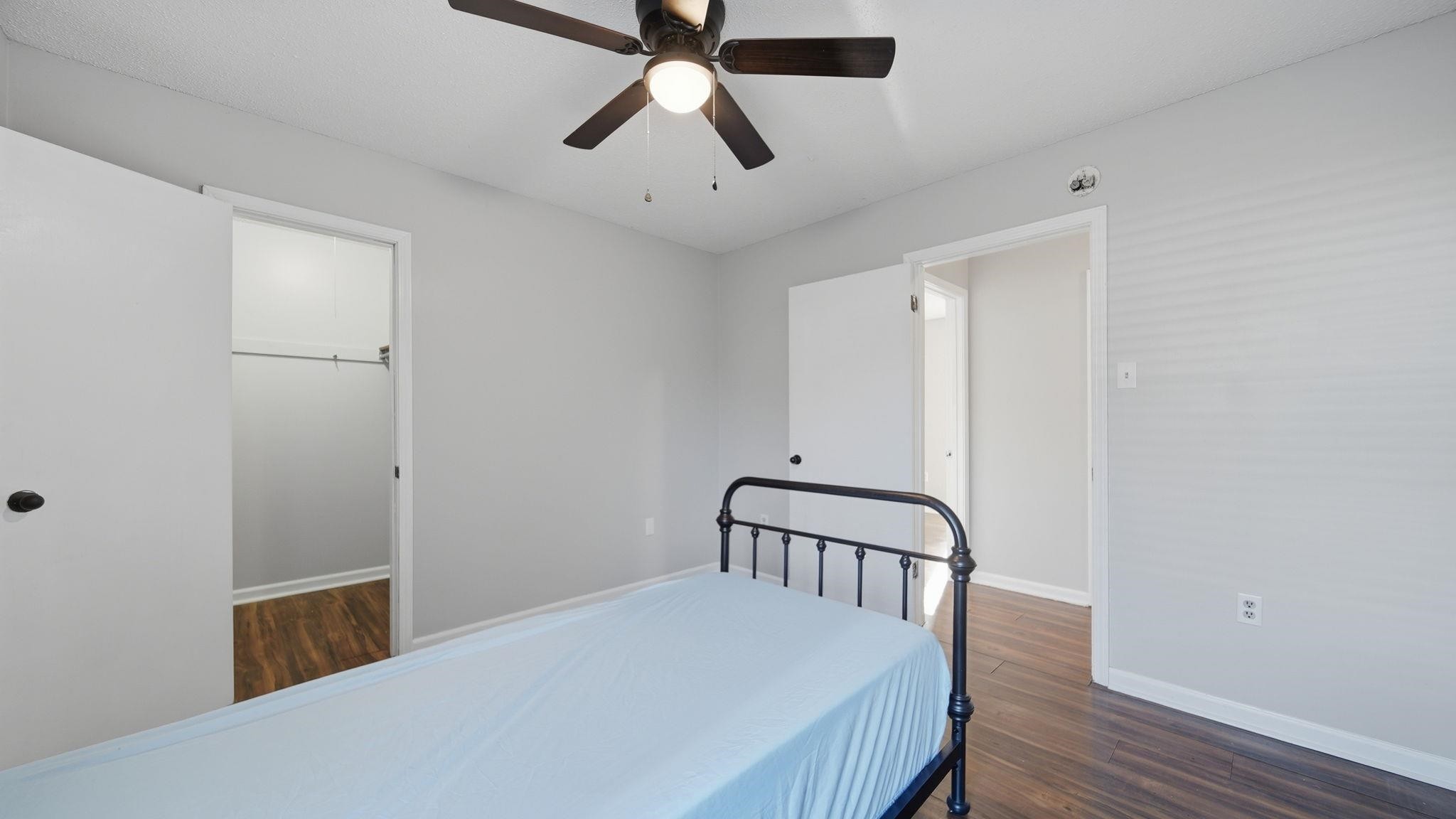 4182 Luther Road Memphis, TN 38135 - Photo 30 of 40 a bedroom with a bed and wooden floor