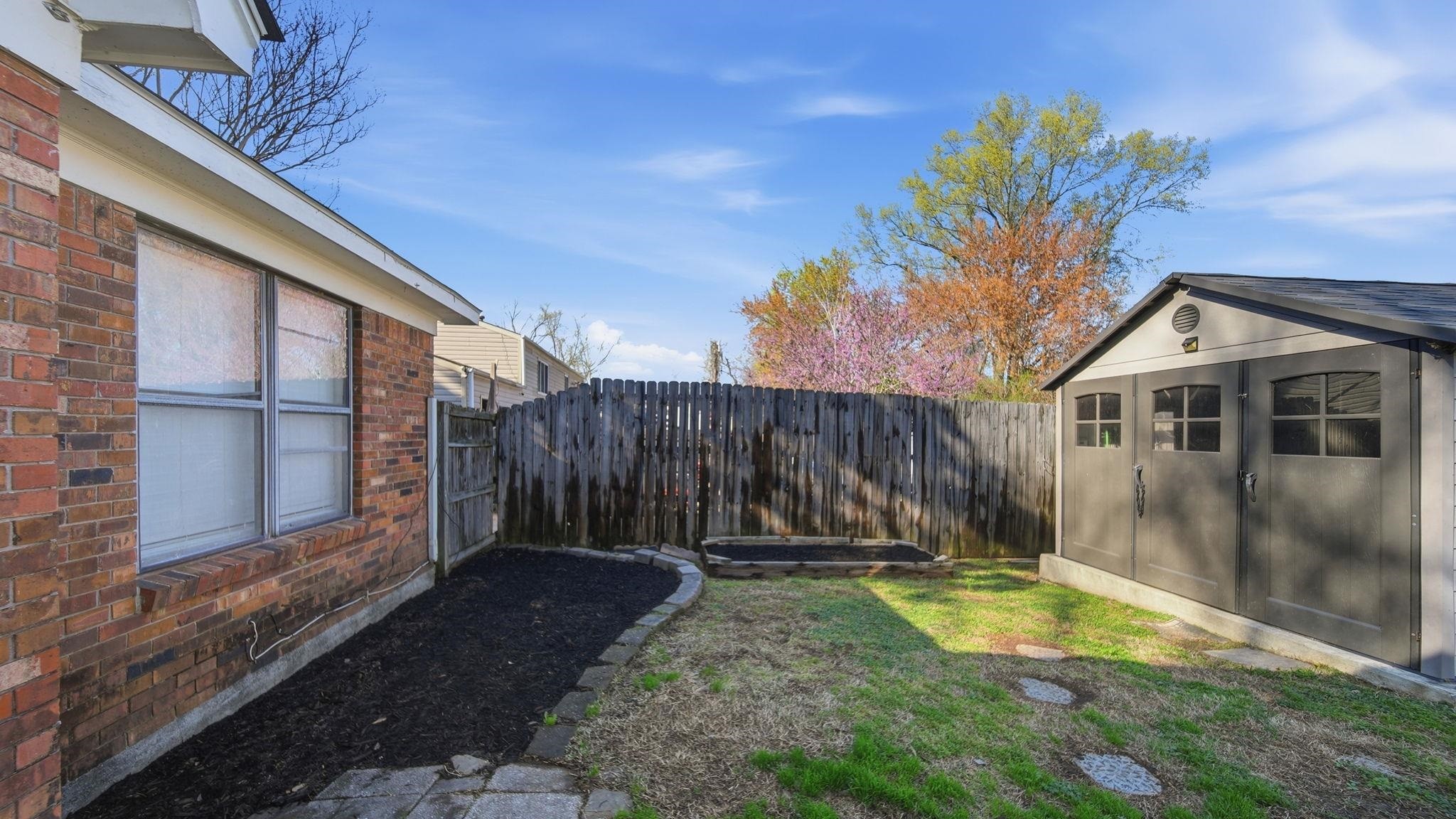 4182 Luther Road Memphis, TN 38135 - Photo 33 of 40 a view of a backyard with a small cabin