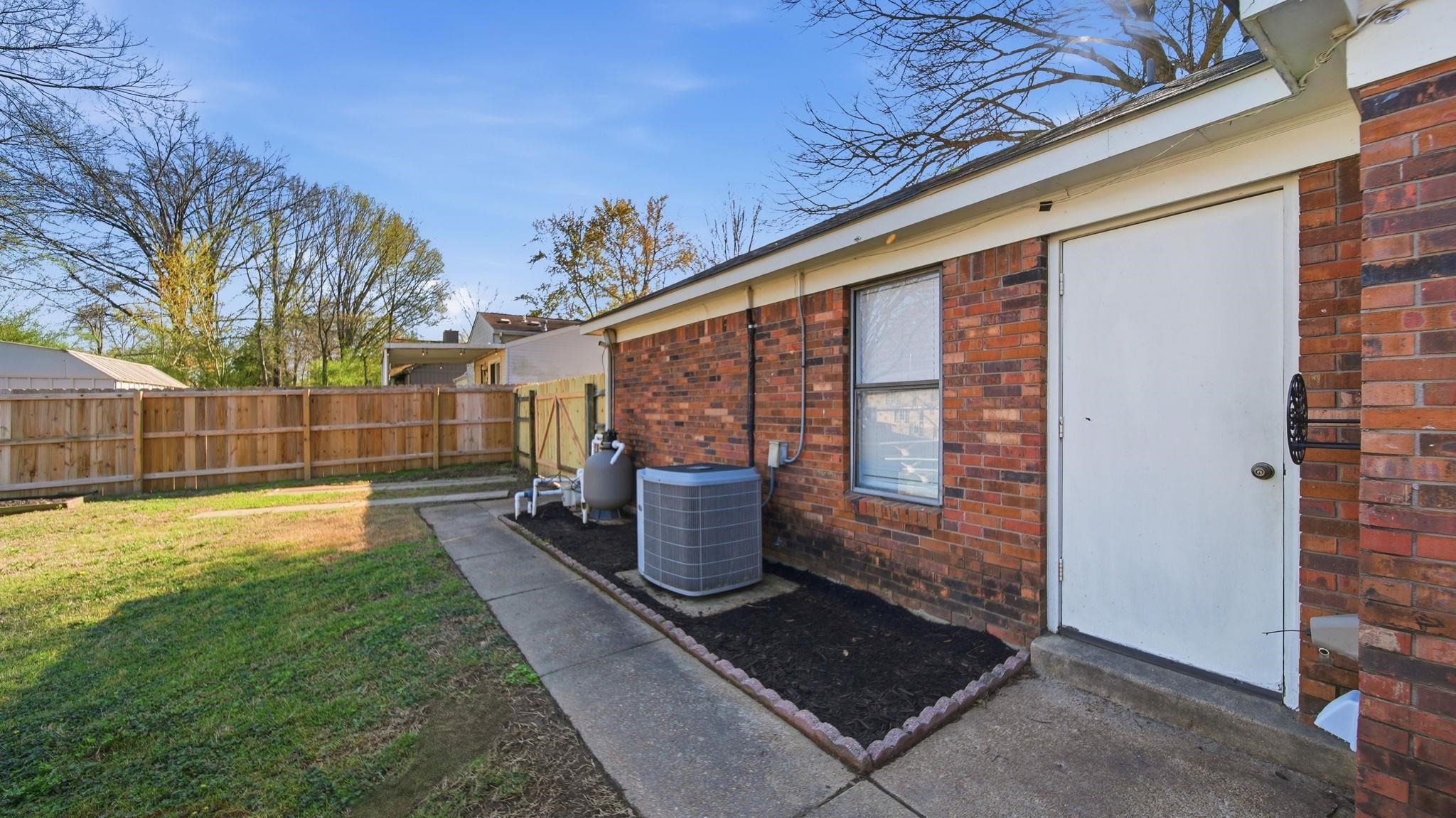 4182 Luther Road Memphis, TN 38135 - Photo 35 of 40 a front view of a house with garden