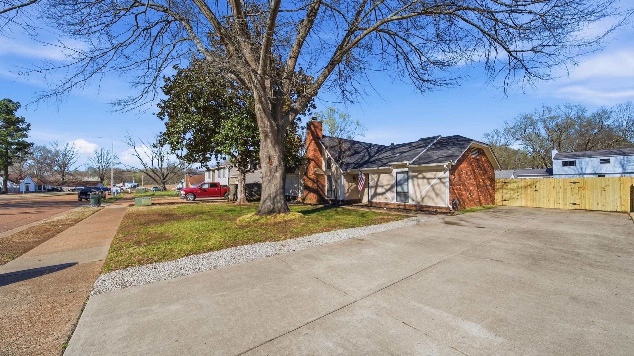 4182 Luther Road Memphis, TN 38135 - Photo 9 of 40 a view of street with parked cars
