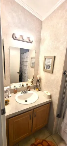 a bathroom with a toilet a sink and a mirror