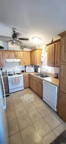 a living room with lots of furniture and refrigerator