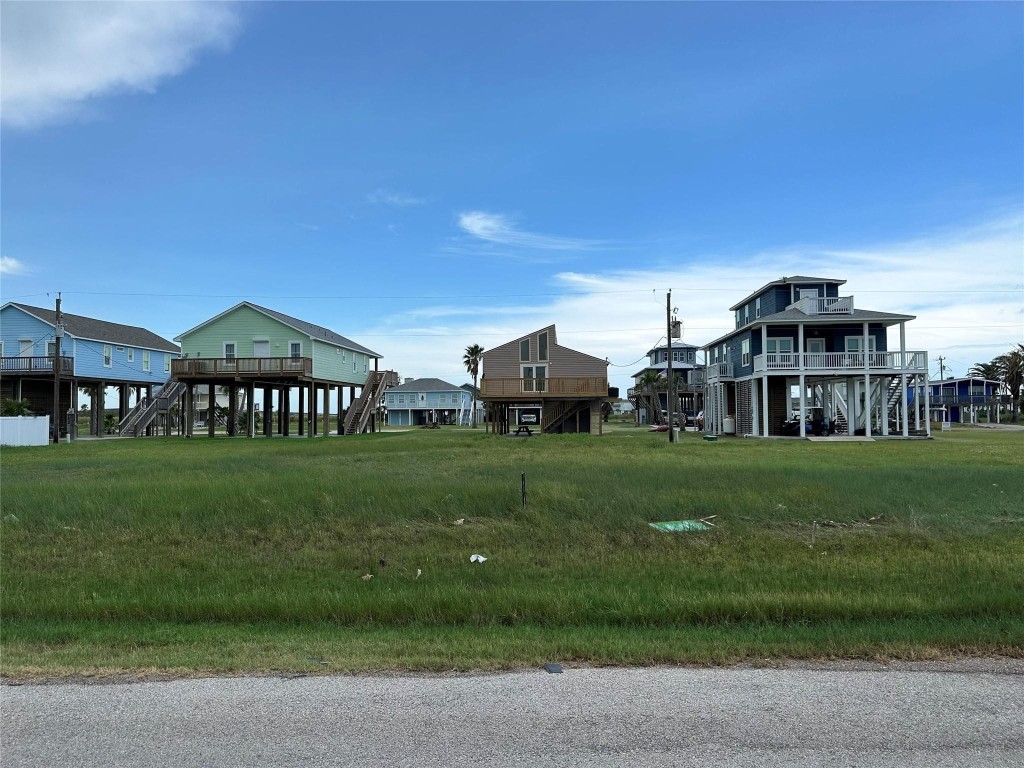 0 Fathom Drive Freeport, TX 77541 - Photo 5 of 6 a view of a big house with a big yard and large trees