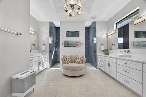 a spacious bathroom with a double vanity sink and a mirror