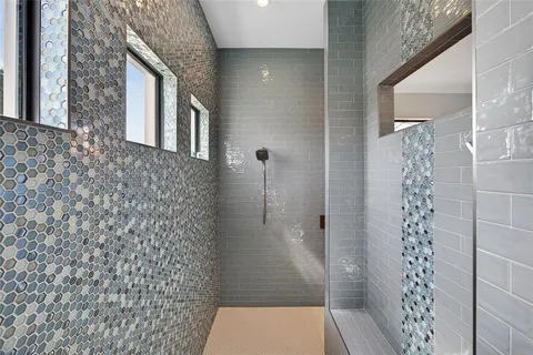 a bedroom with a bed and a view of bathroom