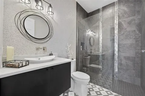 a view of a patio with a dining table and chairs