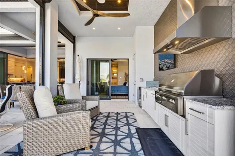 a view of a swimming pool with outdoor seating