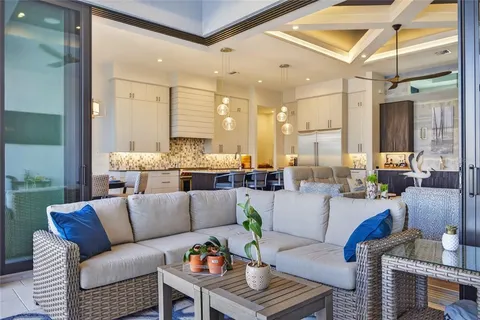 a view of a swimming pool with lawn chairs