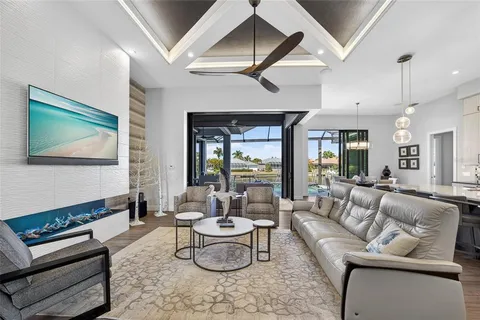 a living room with fireplace furniture and a wooden floor