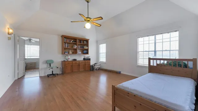 a bedroom with furniture and a window