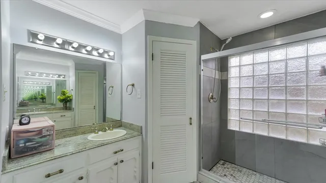 a bathroom with a double vanity sink and a mirror