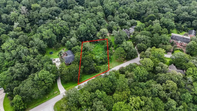 an aerial view of residential house with an outdoor space and street view