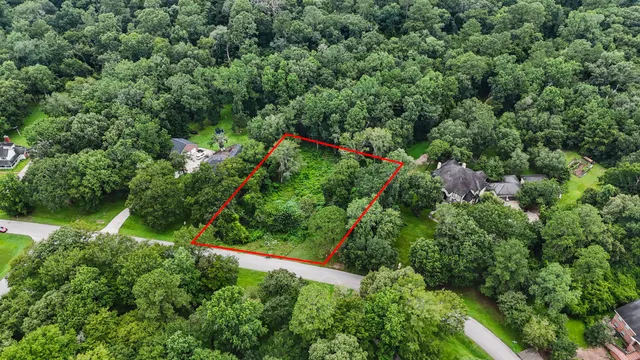 an aerial view of a house with a yard and outdoor seating