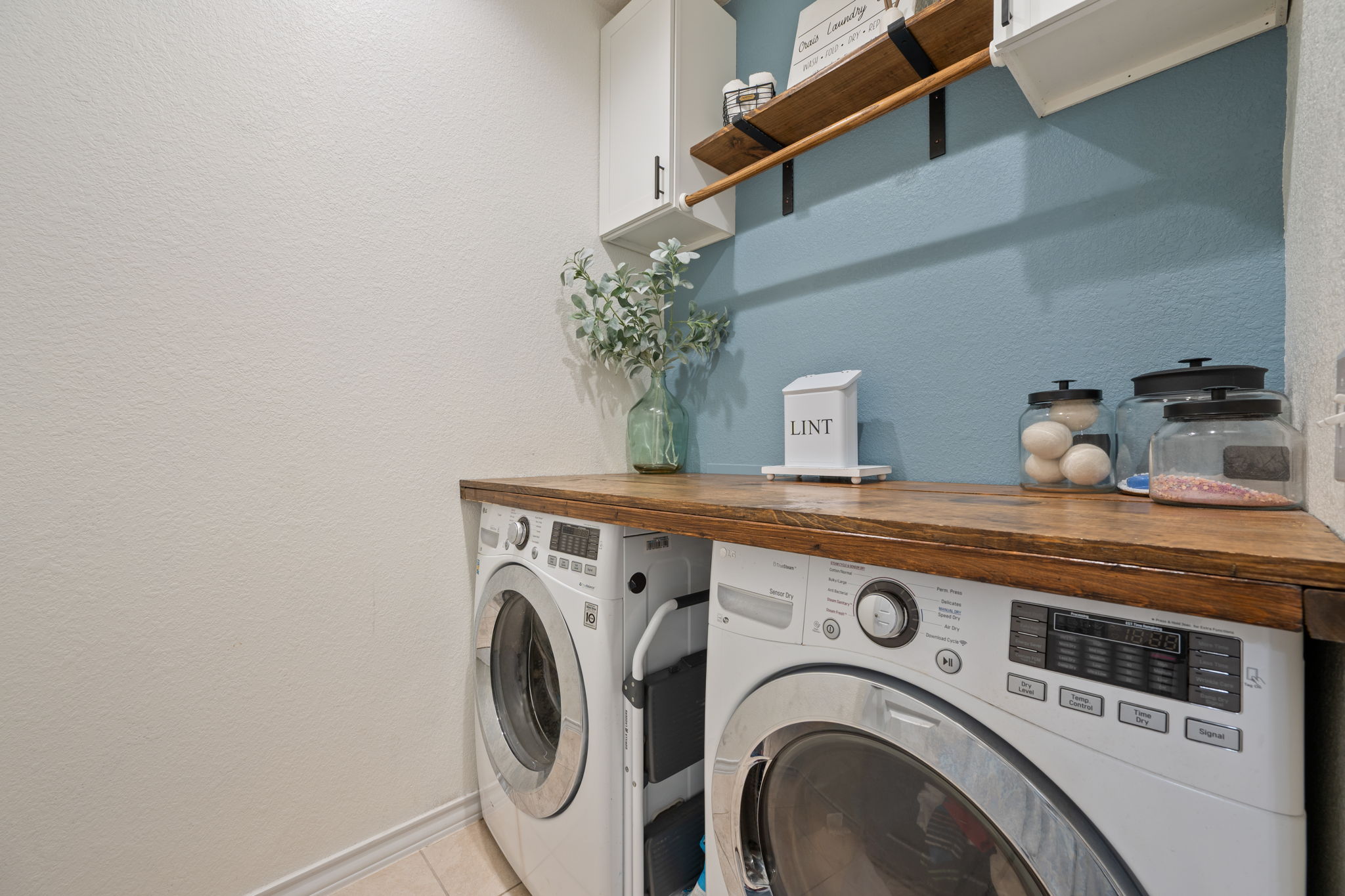 409 Limestone Road Liberty Hill, TX 78642 - Photo 21 of 35 a utility room with dryer and washer