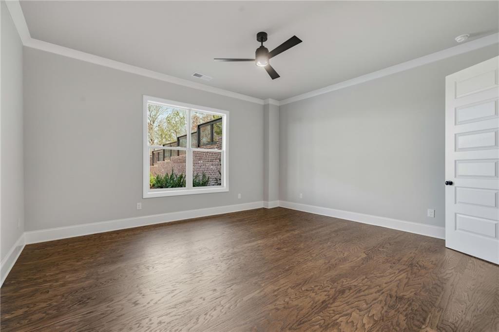 5364 Price Road Gainesville, GA 30506 - Photo 48 of 59 a view of room with window ceiling fan and hardwood floor