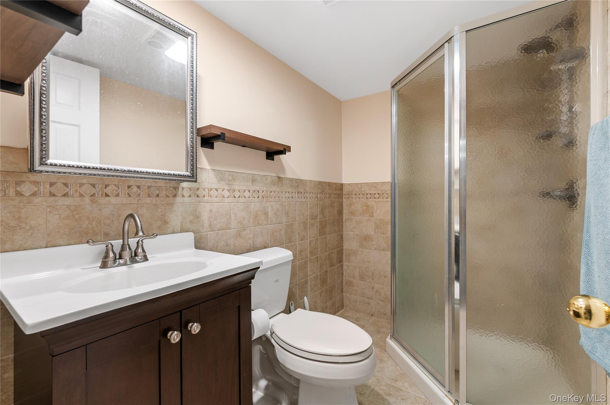 3 Cheshire Road Bethpage, NY 11714 - Photo 23 of 26 a bathroom with a sink toilet and shower
