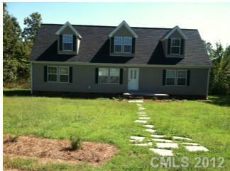 1400 Hall Road Mount Ulla, NC 28125 - Photo 13 of 13 a view of a brick house with a yard