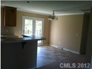 1400 Hall Road Mount Ulla, NC 28125 - Photo 3 of 13 a kitchen with granite countertop a sink and cabinets