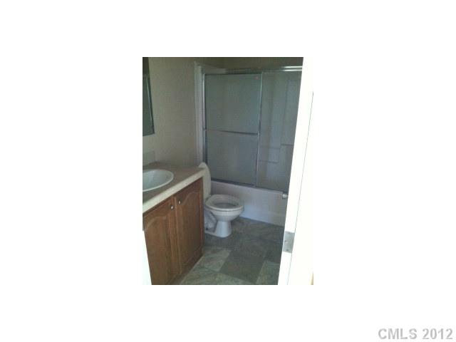 1400 Hall Road Mount Ulla, NC 28125 - Photo 6 of 13 a bathroom with a toilet and a shower
