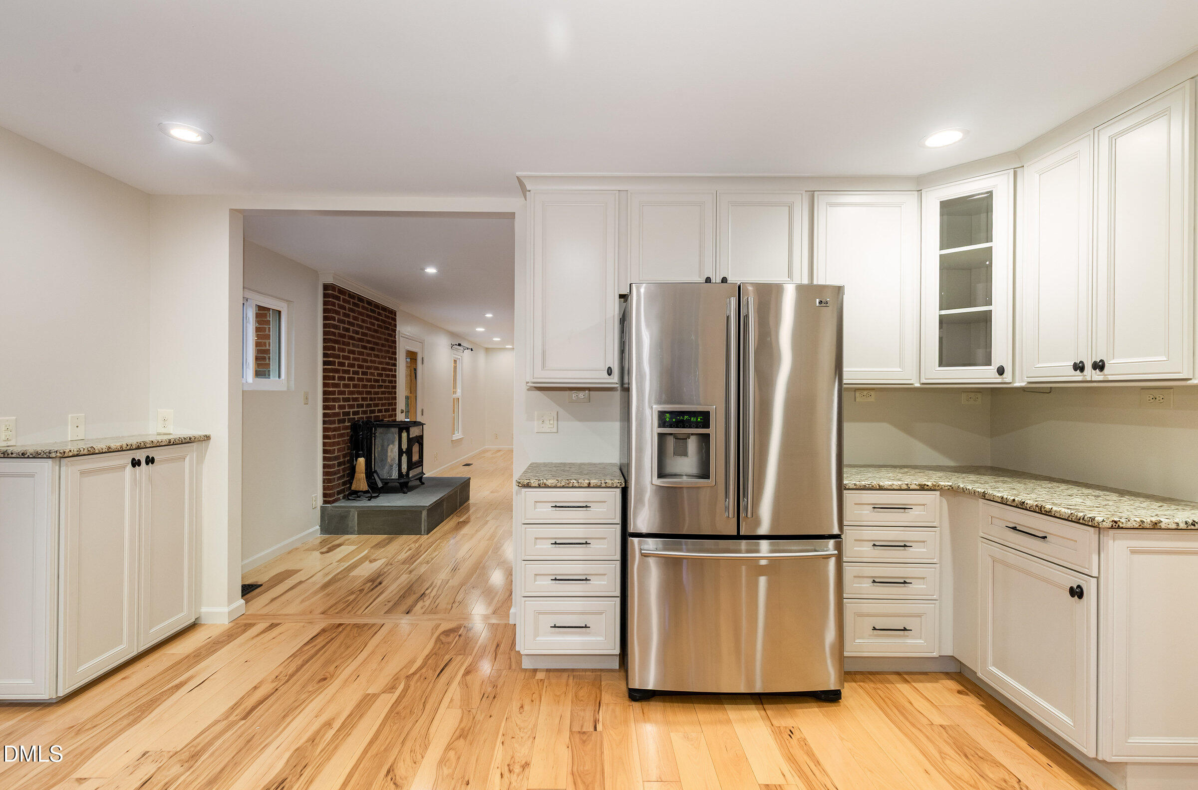 12413 Hardee Road Raleigh, NC 27614 - Photo 17 of 63 a kitchen with stainless steel appliances a refrigerator and wooden cabinets