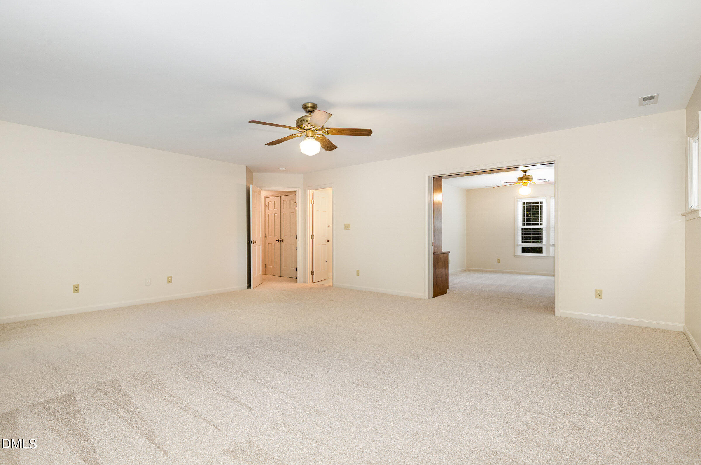 12413 Hardee Road Raleigh, NC 27614 - Photo 24 of 63 an empty room with a bathroom and a chandelier fan