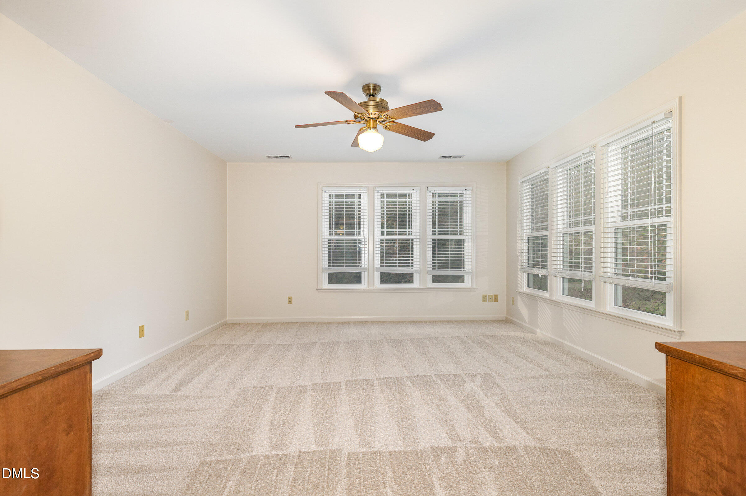 12413 Hardee Road Raleigh, NC 27614 - Photo 26 of 63 a view of a livingroom with a chandelier fan and windows