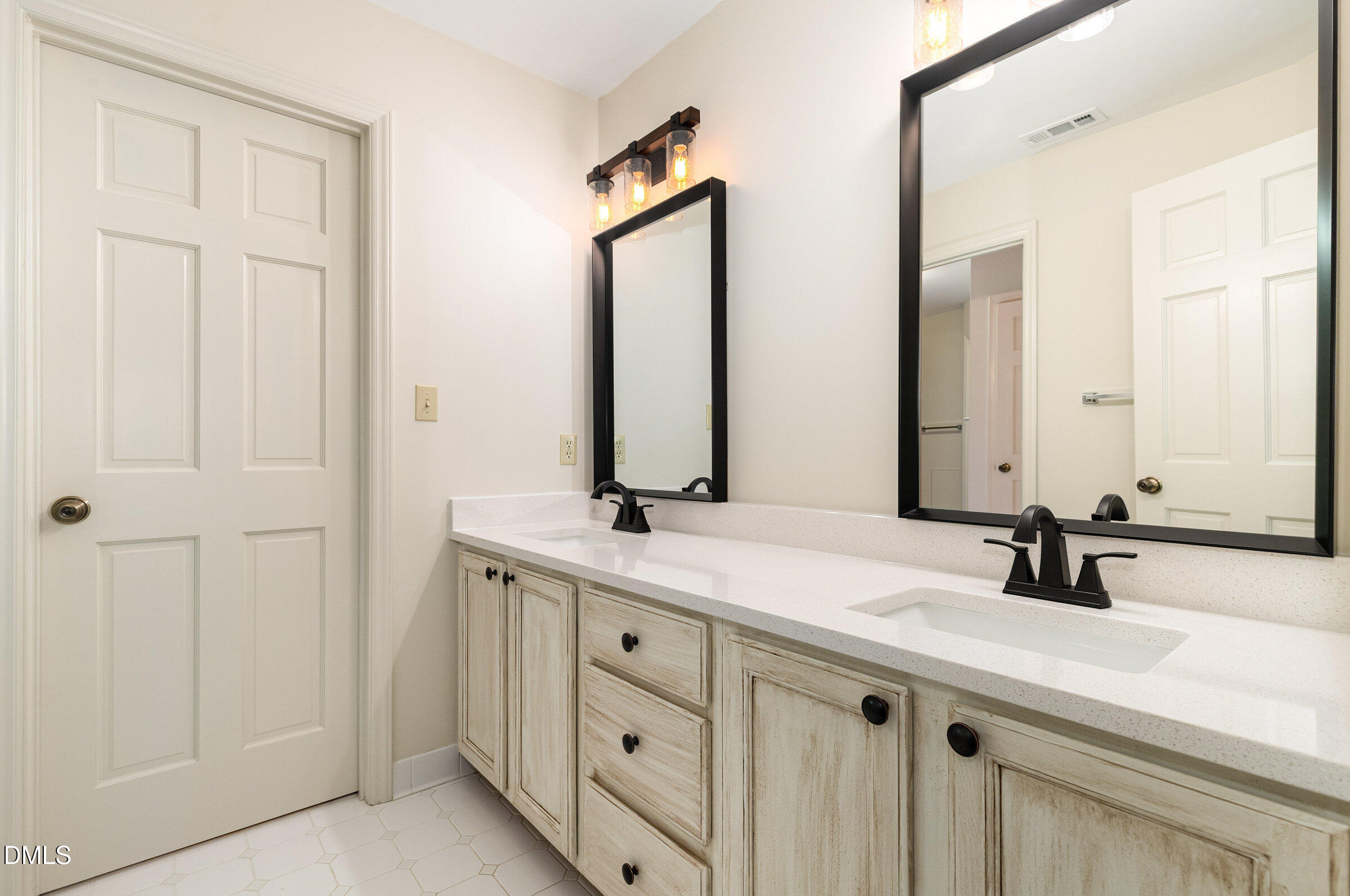 12413 Hardee Road Raleigh, NC 27614 - Photo 28 of 63 a bathroom with a double vanity sink and a mirror
