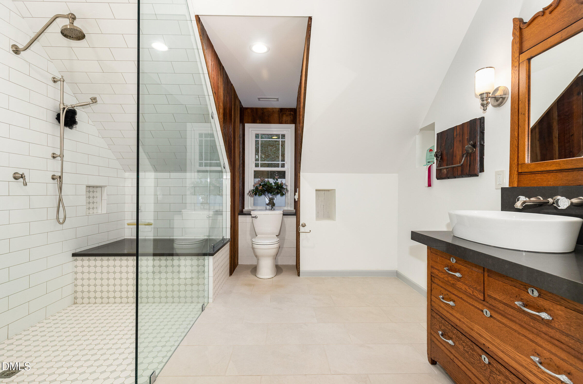 12413 Hardee Road Raleigh, NC 27614 - Photo 37 of 63 a bathroom with a sink a mirror and shower