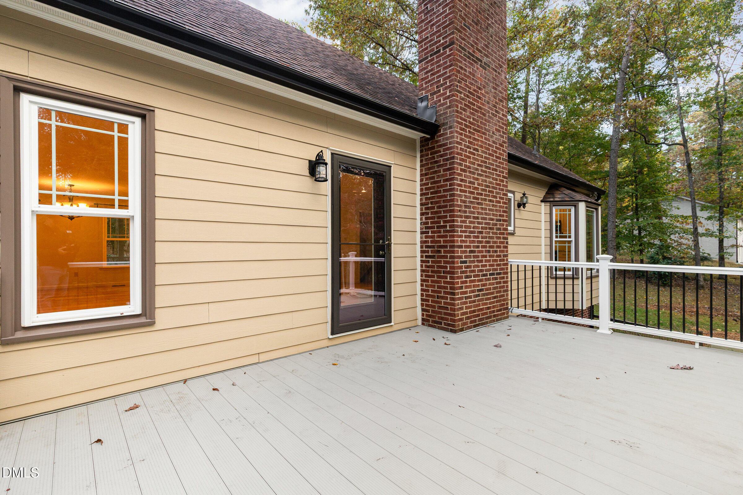12413 Hardee Road Raleigh, NC 27614 - Photo 40 of 63 a view of a house with a wooden deck and a large window