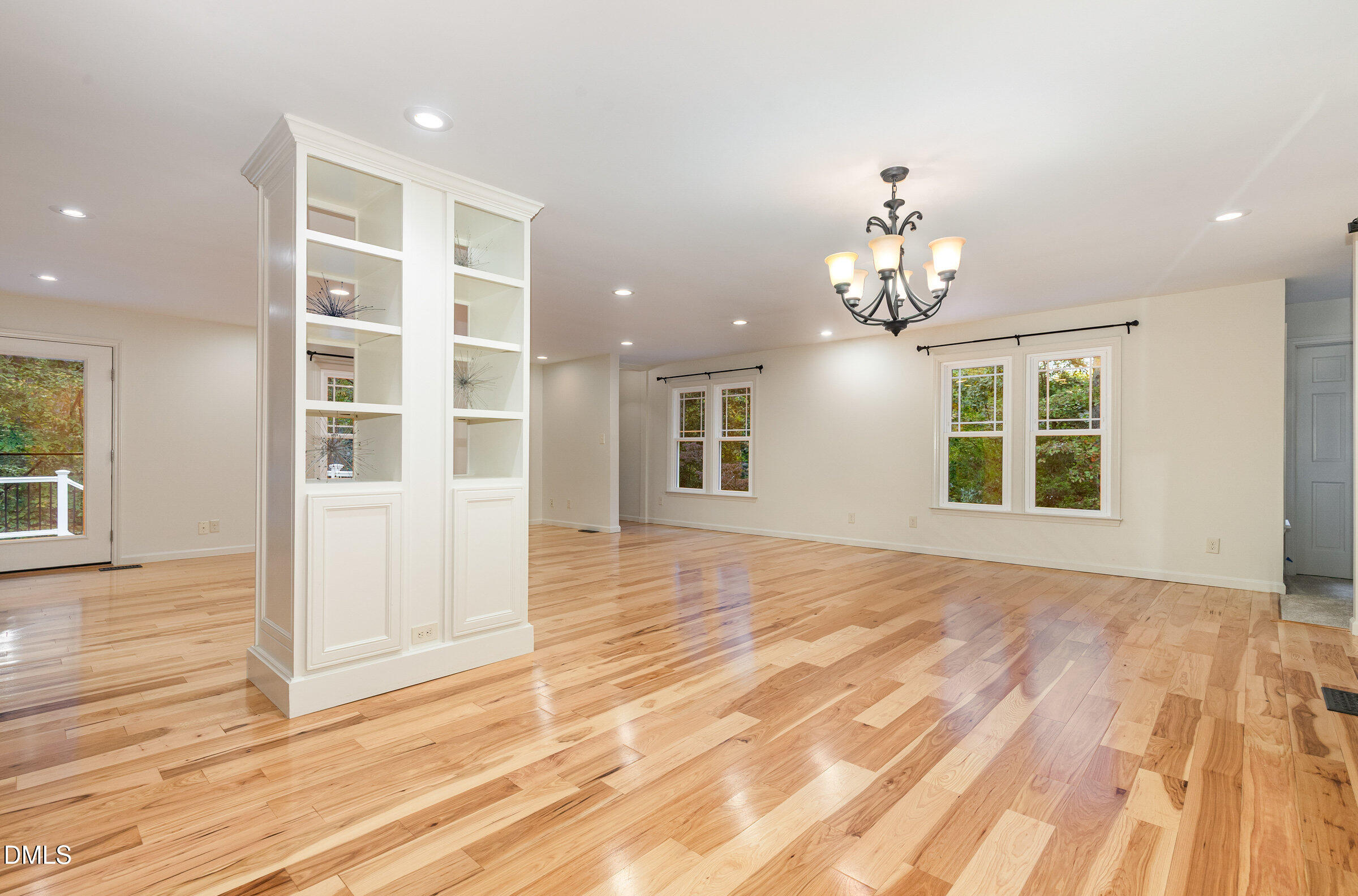 12413 Hardee Road Raleigh, NC 27614 - Photo 5 of 63 a view of an empty room with wooden floor and a window
