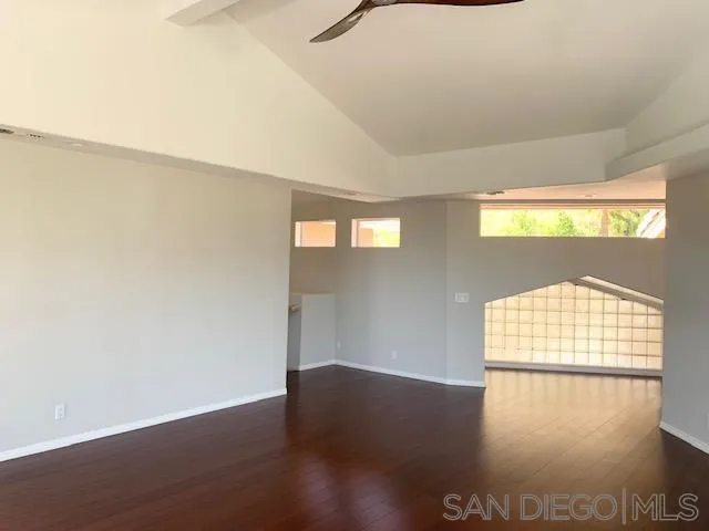 827 Mountain View Road El Cajon, CA 92021 - Photo 14 of 58 a view of an empty room with wooden floor and a window