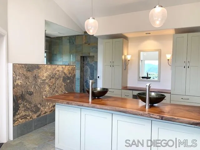 827 Mountain View Road El Cajon, CA 92021 - Photo 19 of 58 a bathroom with a sink and a mirror