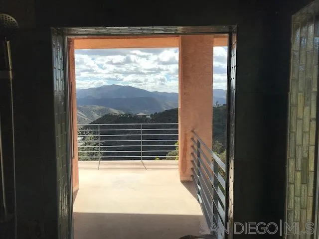 827 Mountain View Road El Cajon, CA 92021 - Photo 25 of 58 a view of balcony and a floor to ceiling window