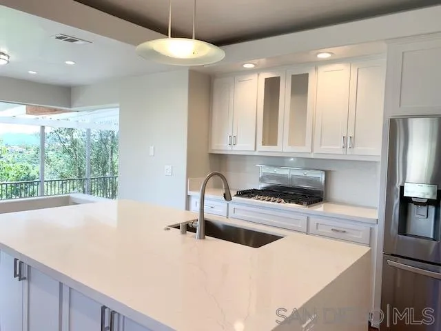 827 Mountain View Road El Cajon, CA 92021 - Photo 3 of 58 a kitchen with stainless steel appliances granite countertop a sink a stove and a refrigerator