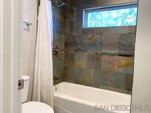 827 Mountain View Road El Cajon, CA 92021 - Photo 31 of 58 a bathroom with a bathtub and shower