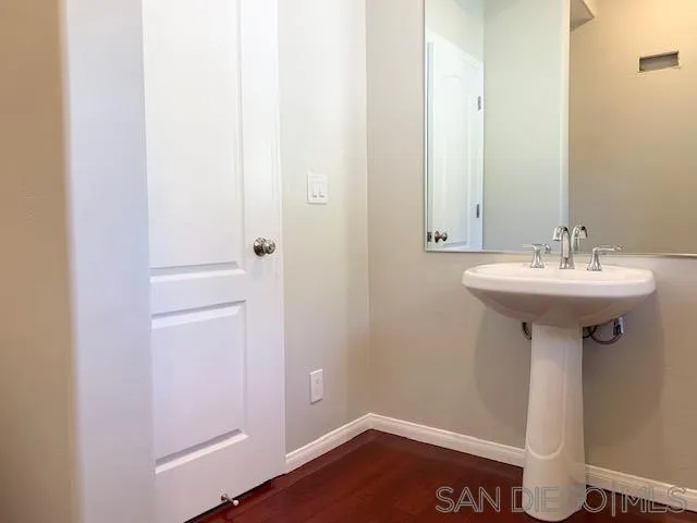 827 Mountain View Road El Cajon, CA 92021 - Photo 33 of 58 a bathroom with a sink and mirror