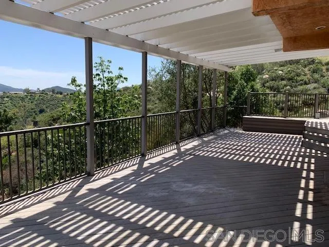 827 Mountain View Road El Cajon, CA 92021 - Photo 37 of 58 a view of a roof deck with wooden floor and fence